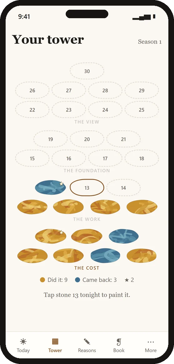 The tower of 30 stones in the app, with painted stones in gold and blue